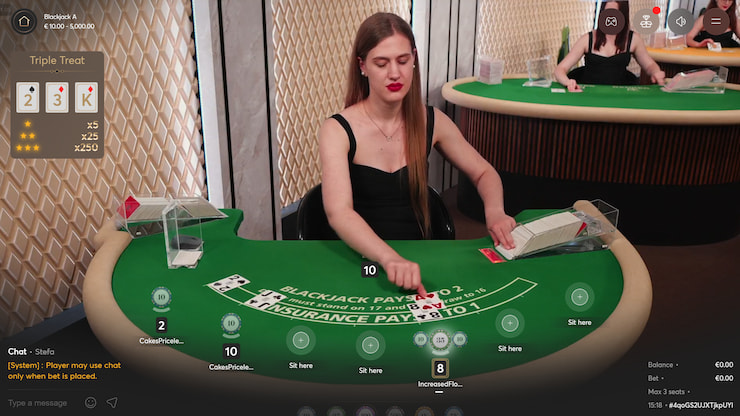 Live blackjack in motion, with a streamed live dealer handing out the cards.