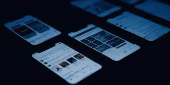 Smartphone screens showing social media platforms in dramatic lighting, illustrating digital investigation