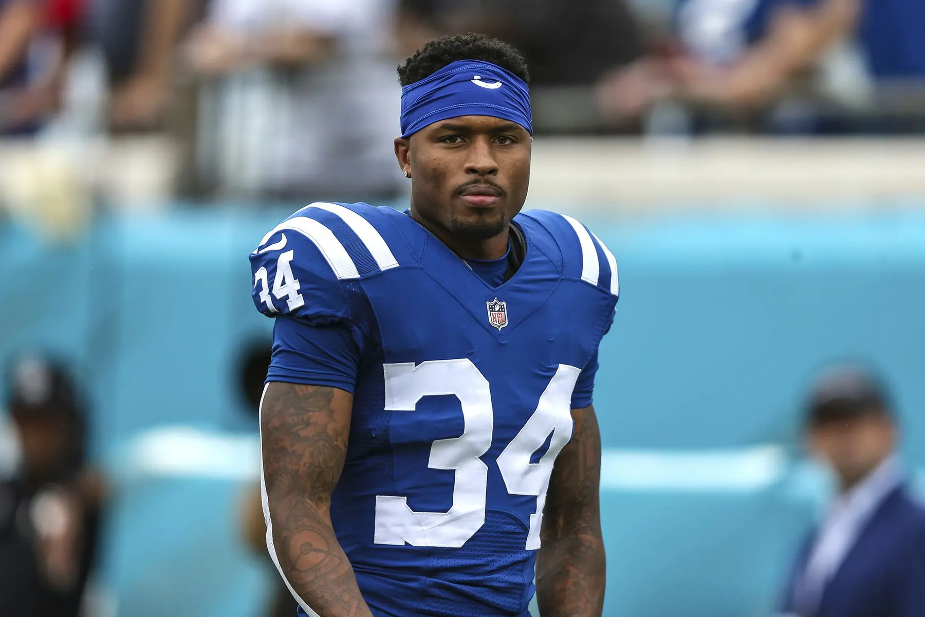 Isaiah Rodgers in a blue Indianapolis Colts jersey looking focused on the field.