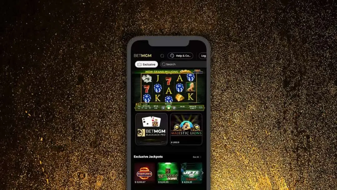 Smartphone displaying a BETMGM casino app with various slot games and options.