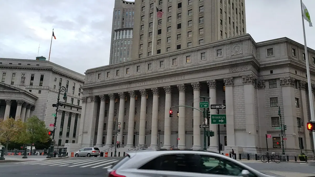 Southern District of New York courthouse with columns and signage visible.