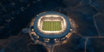 Aerial view of illuminated sports stadium with territorial boundary lines showing jurisdictional oversight
