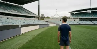 Empty stadium advertising boards and a plain sports uniform symbolise Australia’s proposed wagering ad ban.