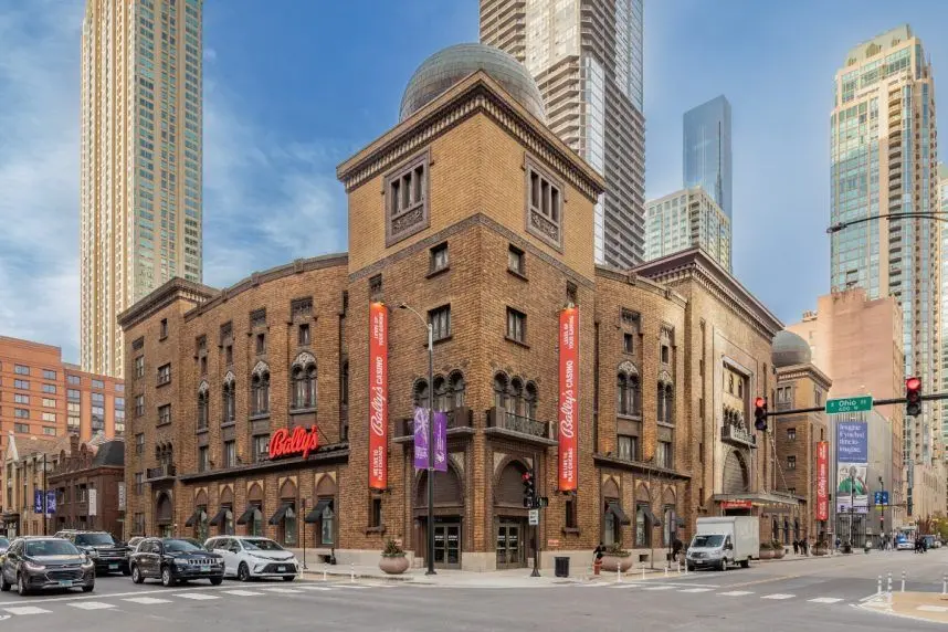 Exterior view of the Bally's casino building in Chicago, featuring brown brick architecture and red branding.