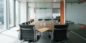 Empty executive meeting room prepared for a European gambling industry leadership handover
