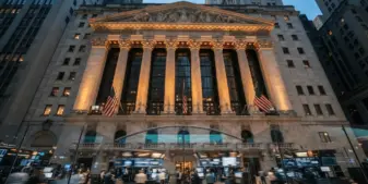 New York Stock Exchange building facade with trading floor, representing Flutter's NYSE-only listing move