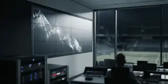 Sports data technology beside a dim stadium, symbolizing slower growth and reduced guidance