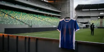 Empty Brazilian football stadium with a blank jersey sponsorship panel symbolising betting ad restrictions
