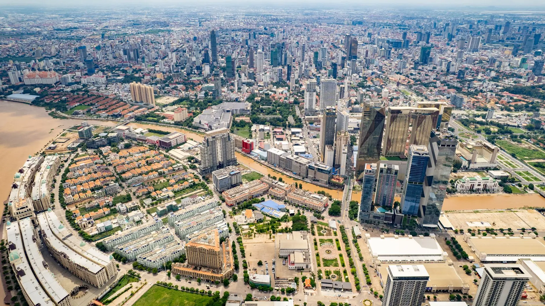 Aerial view of the Phnom Penh city skyline in Cambodia with high-rise buildings and riverfronts