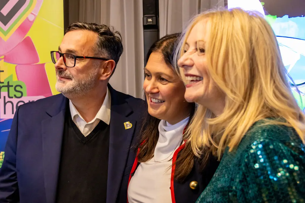 DCMS Secretary of State Lisa Nandy smiling alongside two other people during a visit to Bradford.