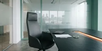 Empty regulatory boardroom chair symbolizing new UK Gambling Commission leadership and oversight changes