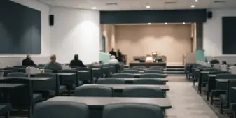 Quiet UK bingo venue with orderly seating representing steady land-based participation